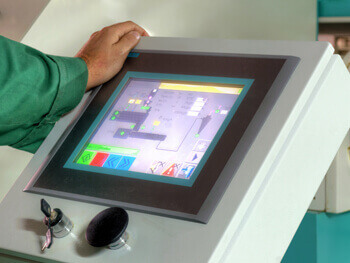 Person utilizing a building automation control panel
